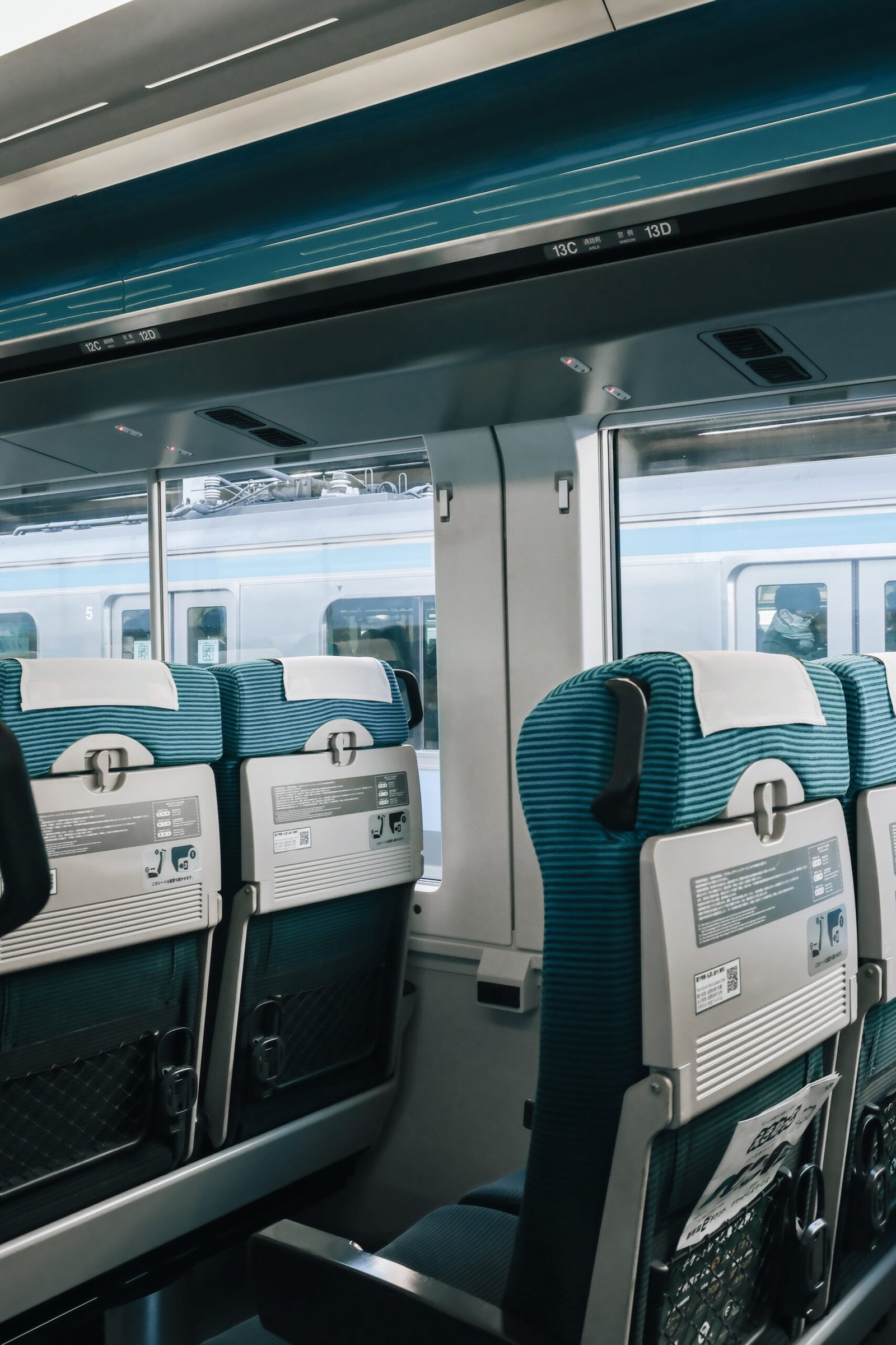 a train car filled with lots of seats next to a window