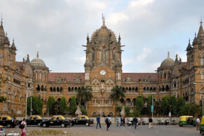 Chhatrapati Shivaji Maharaj Terminus in Mumbai, headquarters of Central Railway. AI image grounded in a real Wikimedia Commons photo by Joe Ravi.