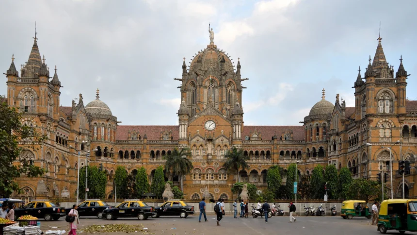 Chhatrapati Shivaji Maharaj Terminus in Mumbai, headquarters of Central Railway. AI image grounded in a real Wikimedia Commons photo by Joe Ravi.