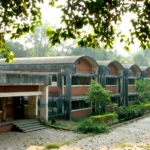 Atomic Energy Central School campus at Anushaktinagar, with its barrel-vault classroom blocks. Image generated from a real Wikimedia Commons photo of the AECS campus.