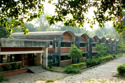 Atomic Energy Central School campus at Anushaktinagar, with its barrel-vault classroom blocks. Image generated from a real Wikimedia Commons photo of the AECS campus.