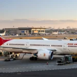 Air India Boeing 787 Dreamliner at an airport gate. AI-generated image grounded in a real photo by RyanZ225 PC / Wikimedia Commons (CC BY-SA 4.0).