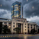 Reserve Bank of India building in Mumbai at dusk. Base photo: Pinakpani / Wikimedia Commons, CC BY-SA 4.0 (background composite)