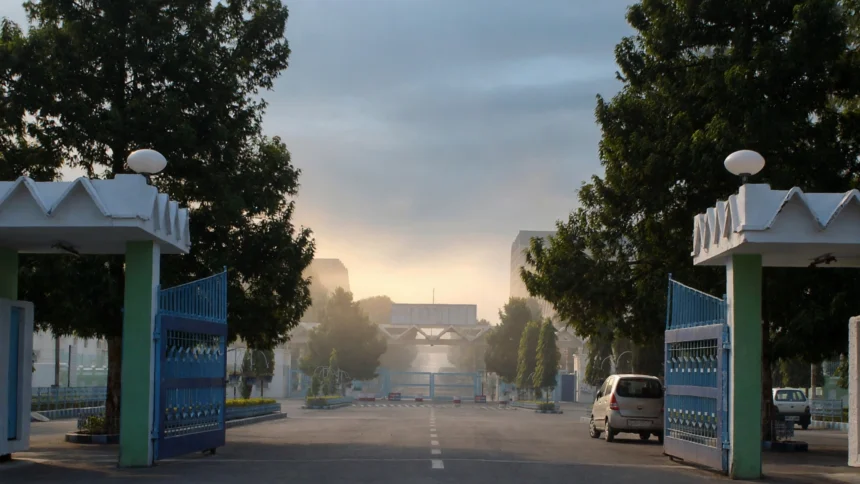 Entrance of a BHEL manufacturing plant. Reference photo: Ekabhishek / Wikimedia Commons (CC BY-SA 3.0), editorial composite.