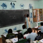 Teacher teaching students in a government school classroom in India