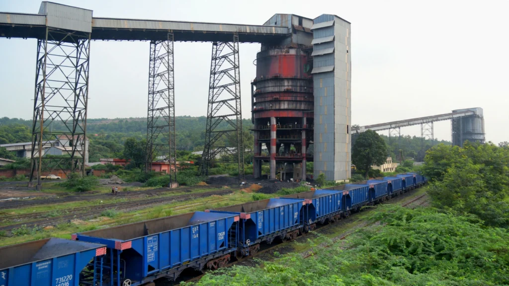 Coal handling plant at Dudhichua coal mine, Singrauli. AI-generated image grounded in a real photo by Rosehubwiki / Wikimedia Commons (CC BY-SA 4.0).