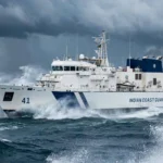 An Indian Coast Guard ship at sea. Photo: BellaNYork / Wikimedia Commons (CC0), background composite.