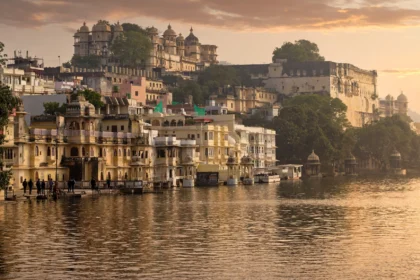 Udaipur Lake Pichola and City Palace at sunset.
