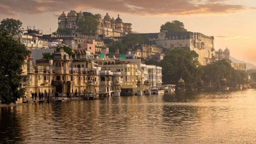 Udaipur Lake Pichola and City Palace at sunset.