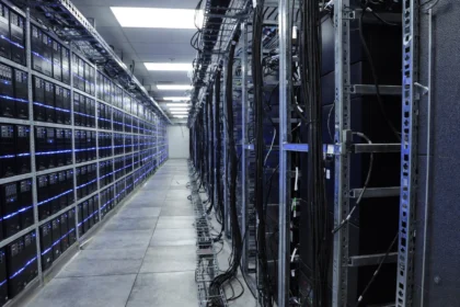 Data centre server room with rows of server racks, illustrative image for Google Gemini 4 Carbon.