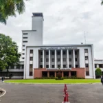 IIT Kharagpur main building. Reference photo: Bubai Manna / Wikimedia Commons (CC BY-SA 4.0); AI-generated editorial image grounded in the real photo.