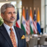 S Jaishankar at a diplomatic summit, with Indian and US flags behind him. Photo: U.S. Department of State / Wikimedia Commons (background composite).