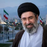 Iran's Supreme Leader Mojtaba Khamenei. Photo reference: khamenei.ir / Wikimedia Commons (background composite).