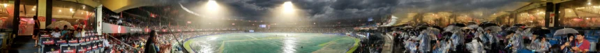 M. Chinnaswamy Stadium, Bengaluru, during the rain-hit IND vs WI T20 decider (Photo: Indrashis / Wikimedia Commons, AI composite)