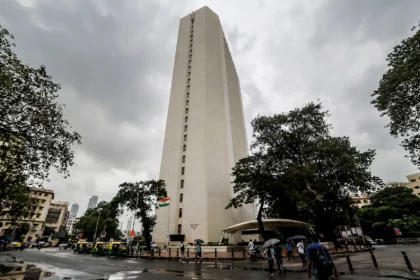 Reserve Bank of India headquarters tower in Mumbai. AI-generated image grounded in a real photo by Pinakpani / Wikimedia Commons (CC BY-SA 4.0).