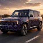 Illustrative image of a camouflaged electric SUV test mule during road testing on an Indian highway.
