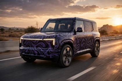 Illustrative image of a camouflaged electric SUV test mule during road testing on an Indian highway.