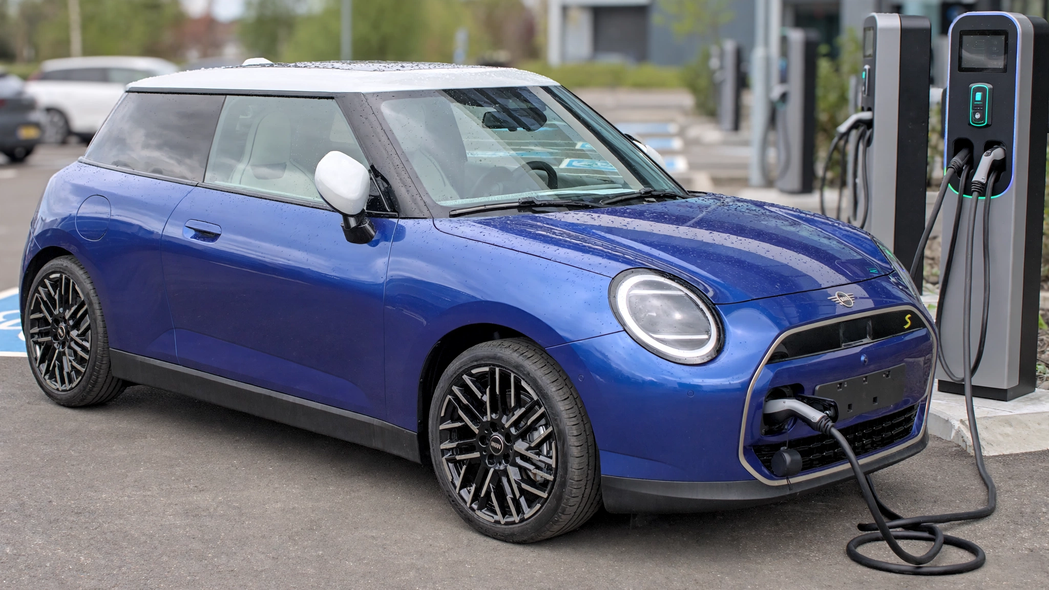New Mini Cooper SE electric hatchback at a charging station