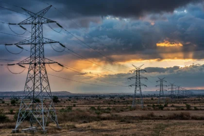 High-voltage transmission towers at dusk