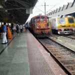 Indian Railways train at a busy station platform