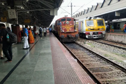 Indian Railways train at a busy station platform
