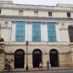 State Bank of India branch building (reference photo: Wikimedia Commons, AI editorial rendering).