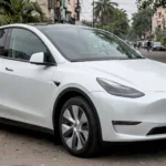 Tesla Model Y on an Indian city street (AI image grounded in a real Model Y photo)