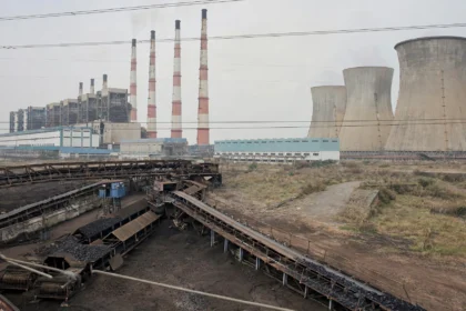 Illustrative view of a large lignite thermal power station with chimneys and cooling towers