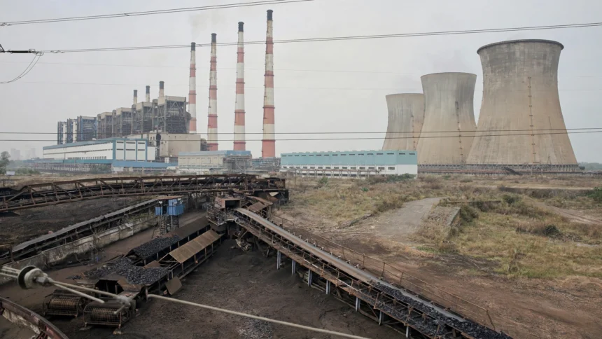 Illustrative view of a large lignite thermal power station with chimneys and cooling towers