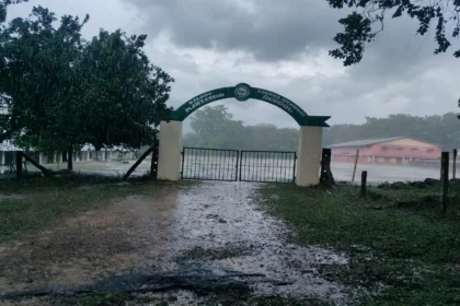 Closed school gate in heavy rain during Cyclone Arnab.