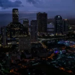 Colombo skyline at dusk. Skyline photo: Thilina Alagiyawanna / Wikimedia Commons (CC0), composite.