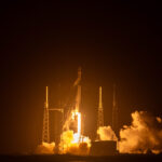 Falcon 9 rocket carrying Starlink satellites at liftoff.