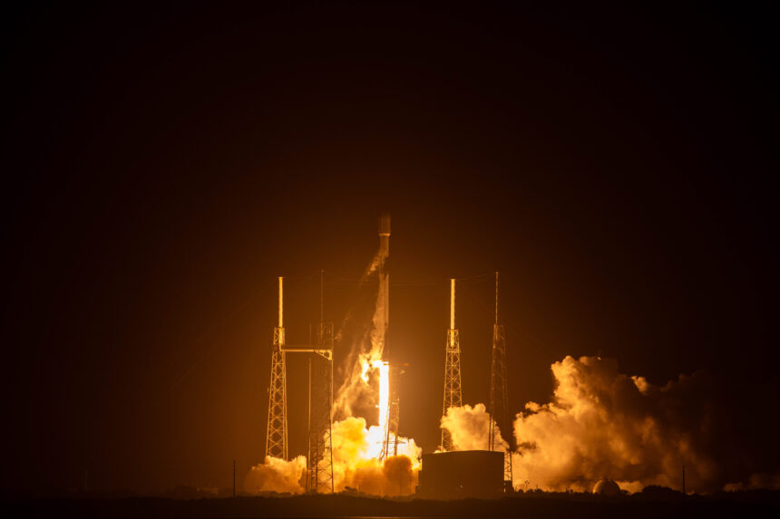 Falcon 9 rocket carrying Starlink satellites at liftoff.