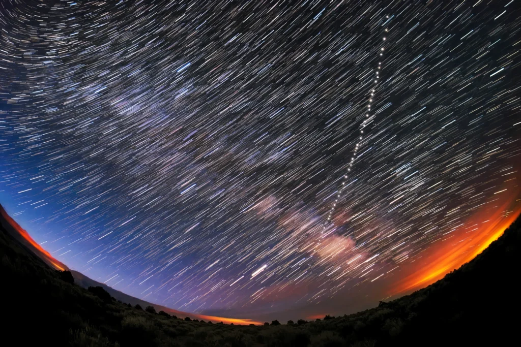 Starlink satellite train across the night sky.