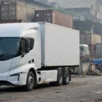 An electric container truck at a logistics hub, representative image.
