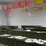 Empty classroom with desks set for a board examination