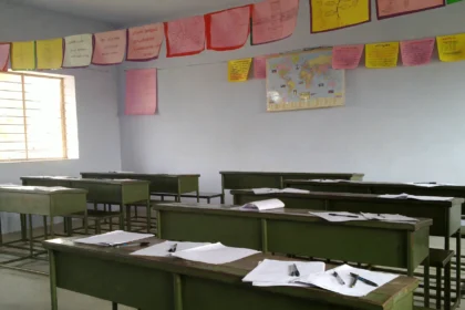 Empty classroom with desks set for a board examination