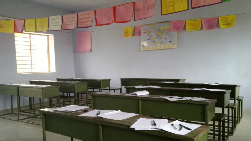 Empty classroom with desks set for a board examination