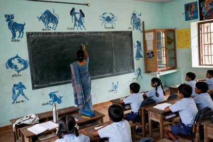 Government primary school classroom in India, teacher at the blackboard.