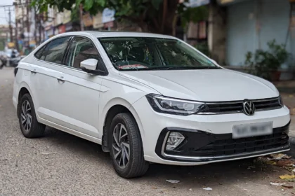 Volkswagen Virtus sedan parked on an Indian city street.