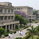 PGIMER Chandigarh campus, doctors in white coats walking between institute buildings